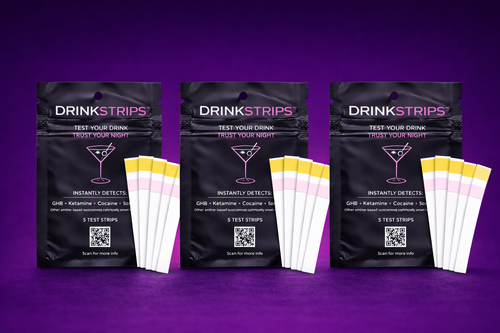 Three packages of DrinkStrips on a purple background
